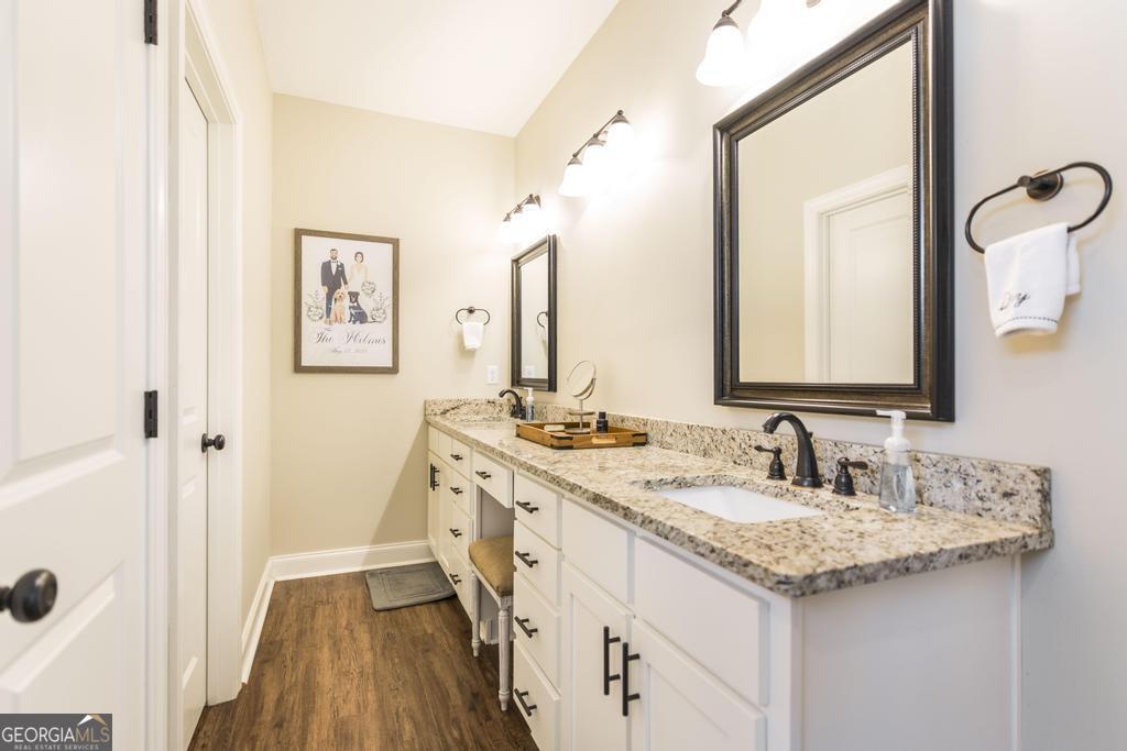 609 Live Oak Way Dublin, GA 31021 - Photo 23 of 37 a bathroom with a double vanity sink mirror and