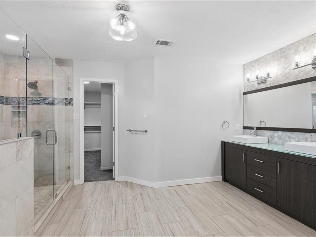 5304 Los Altos Road Fort Worth, TX 76244 - Photo 20 of 30 Full bathroom featuring double vanity, a stall shower, and a walk in closet