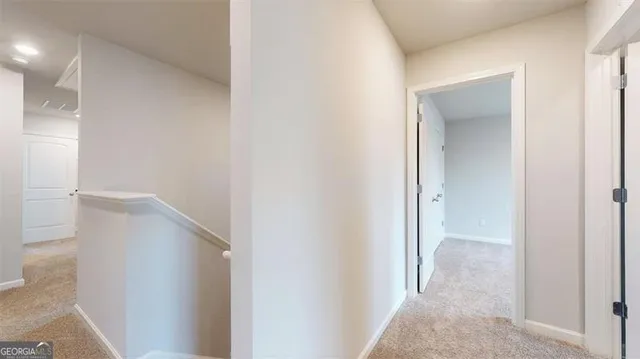 a bathroom with a granite countertop toilet a sink and a mirror