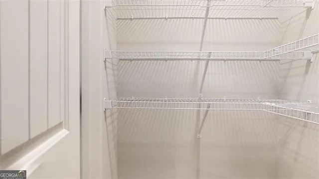 a view of a room with racks on the wall