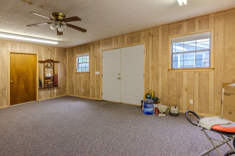 483 Riverside Drive Palacios, TX 77465 - Photo 27 of 41 a view of a livingroom with a chandelier fan and a window