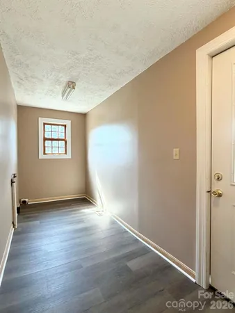 a utility room with sink dryer and washer