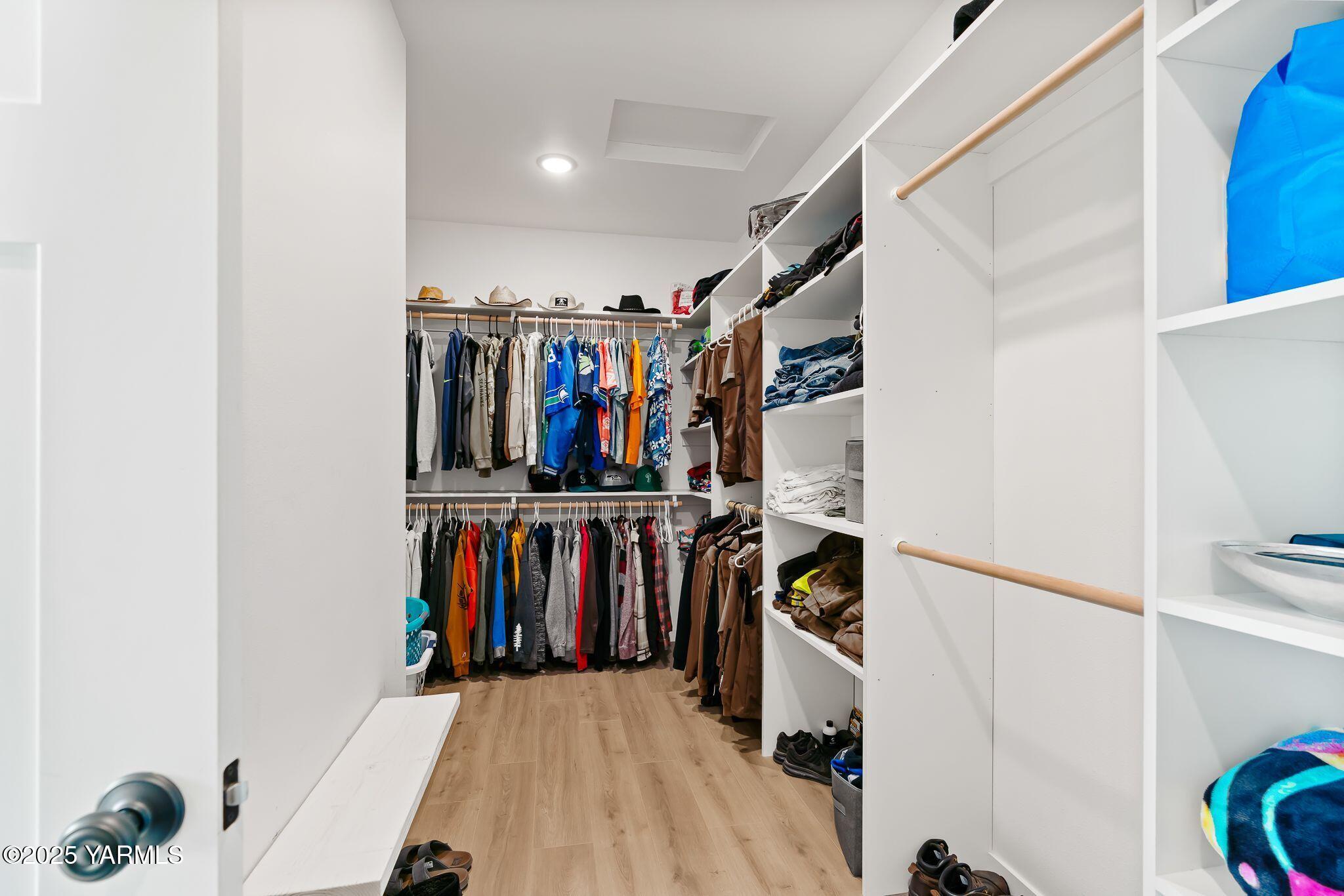 12907 Douglas Road Yakima, WA 98908 - Photo 19 of 44 a view of walk in closet with clothes and shoes