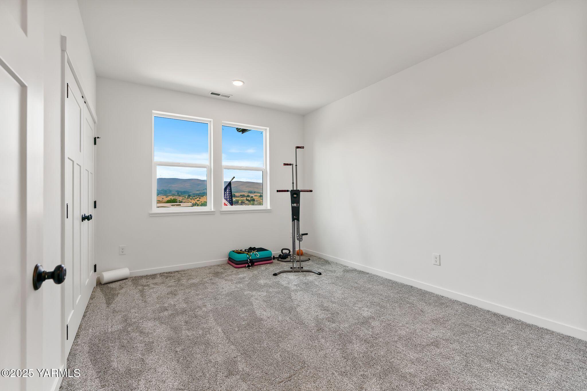 12907 Douglas Road Yakima, WA 98908 - Photo 22 of 44 a view of an empty room with a window