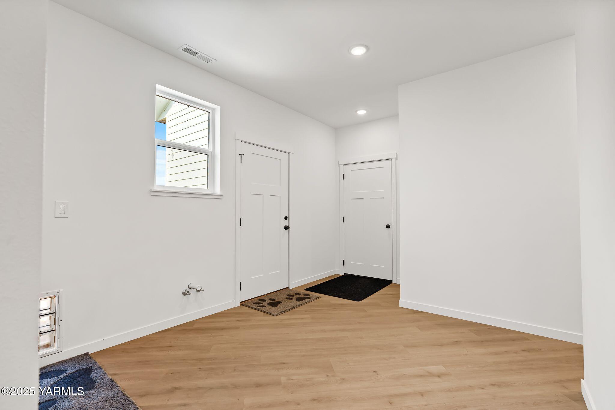 12907 Douglas Road Yakima, WA 98908 - Photo 25 of 44 a view of empty room with wooden floor