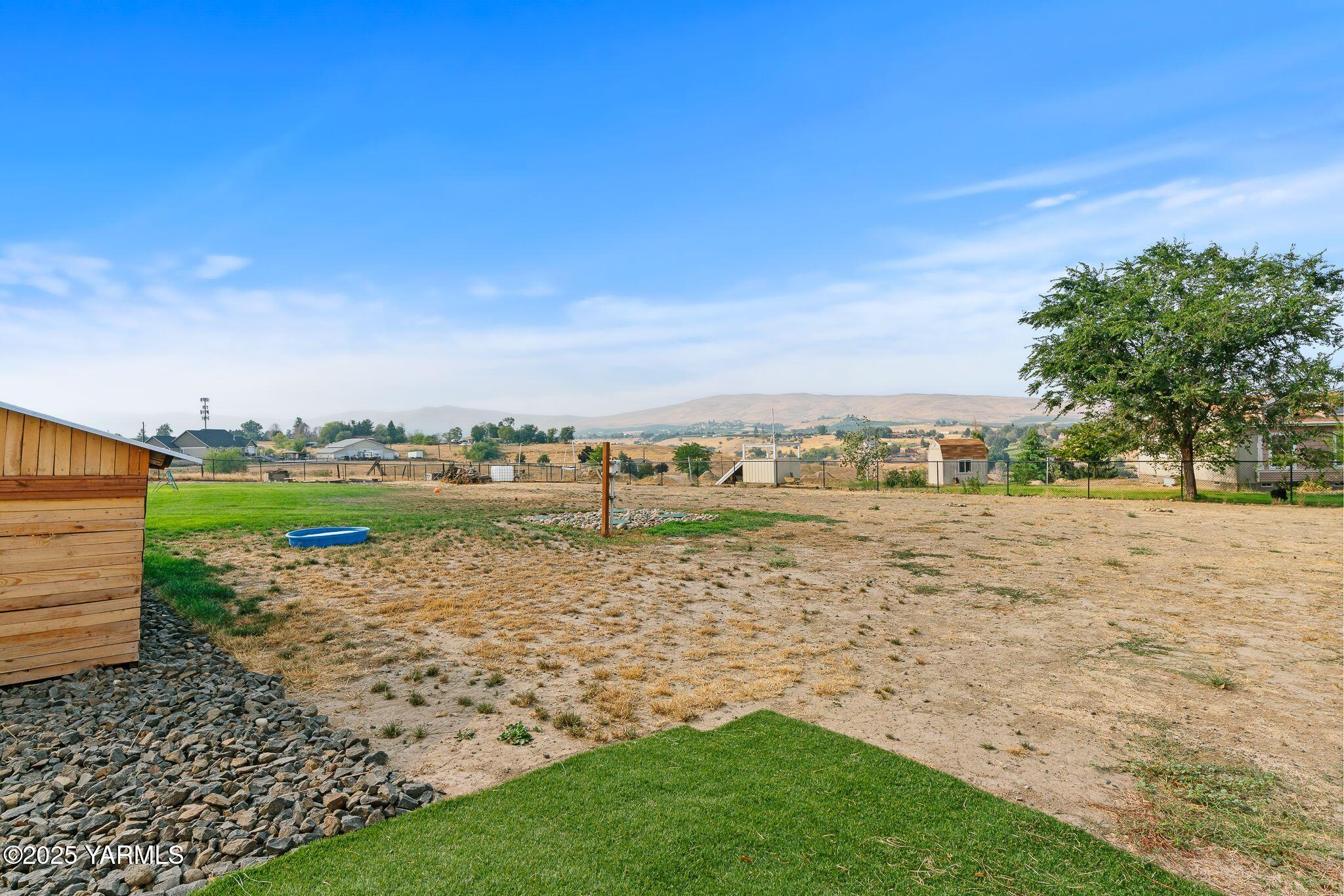 12907 Douglas Road Yakima, WA 98908 - Photo 31 of 44 a view of a lake with houses in the back