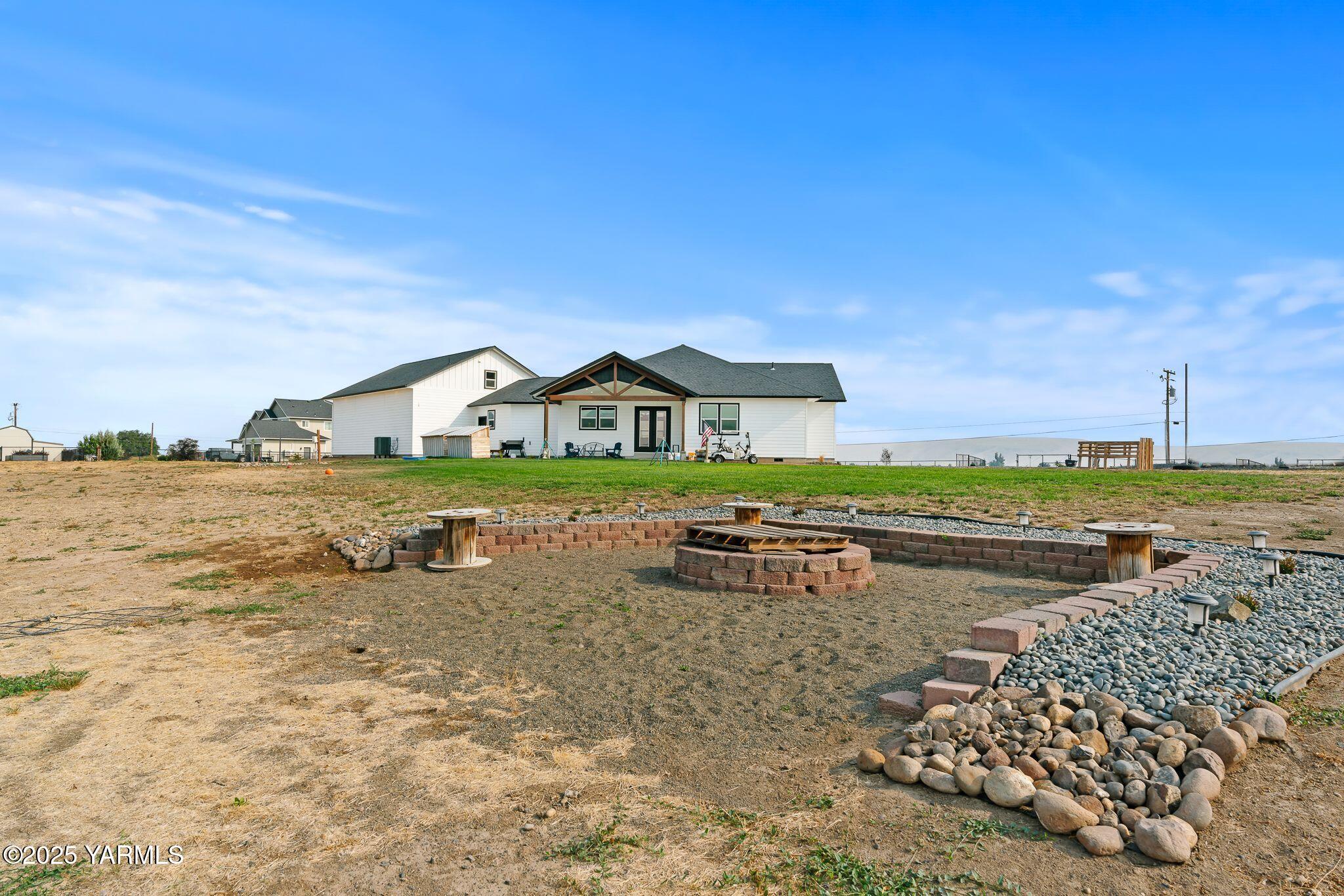 12907 Douglas Road Yakima, WA 98908 - Photo 34 of 44 a view of a lake with a building in the background