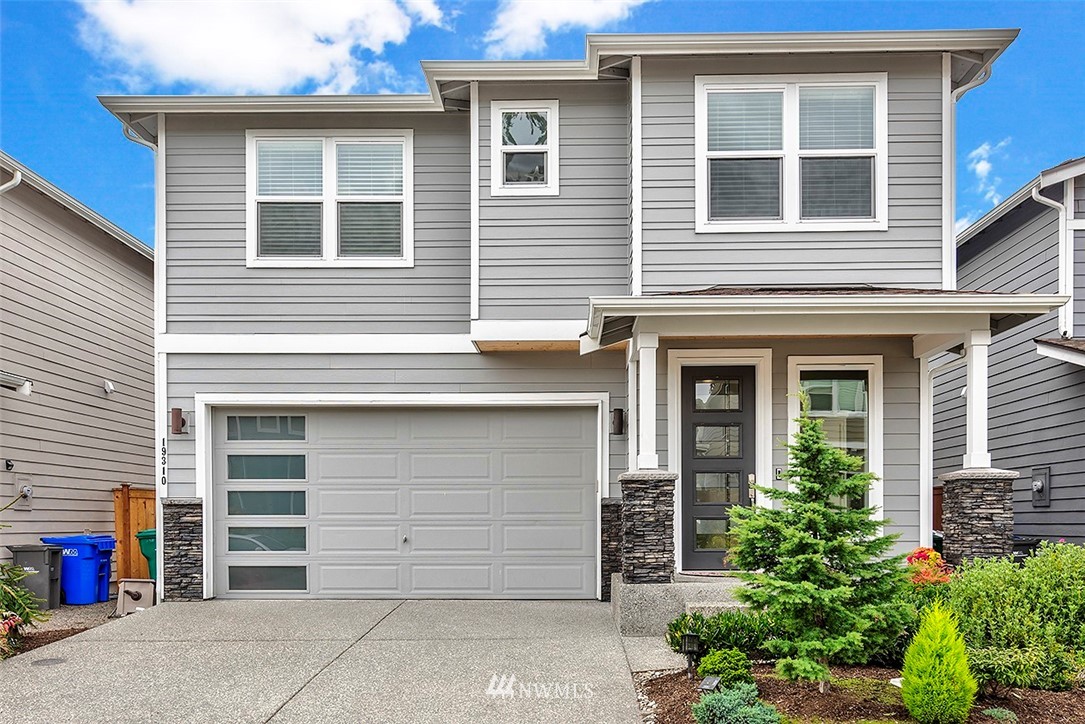 19310 37th Drive Southeast Bothell, WA 98012 - Photo 1 of 22 a front view of a house with a garage