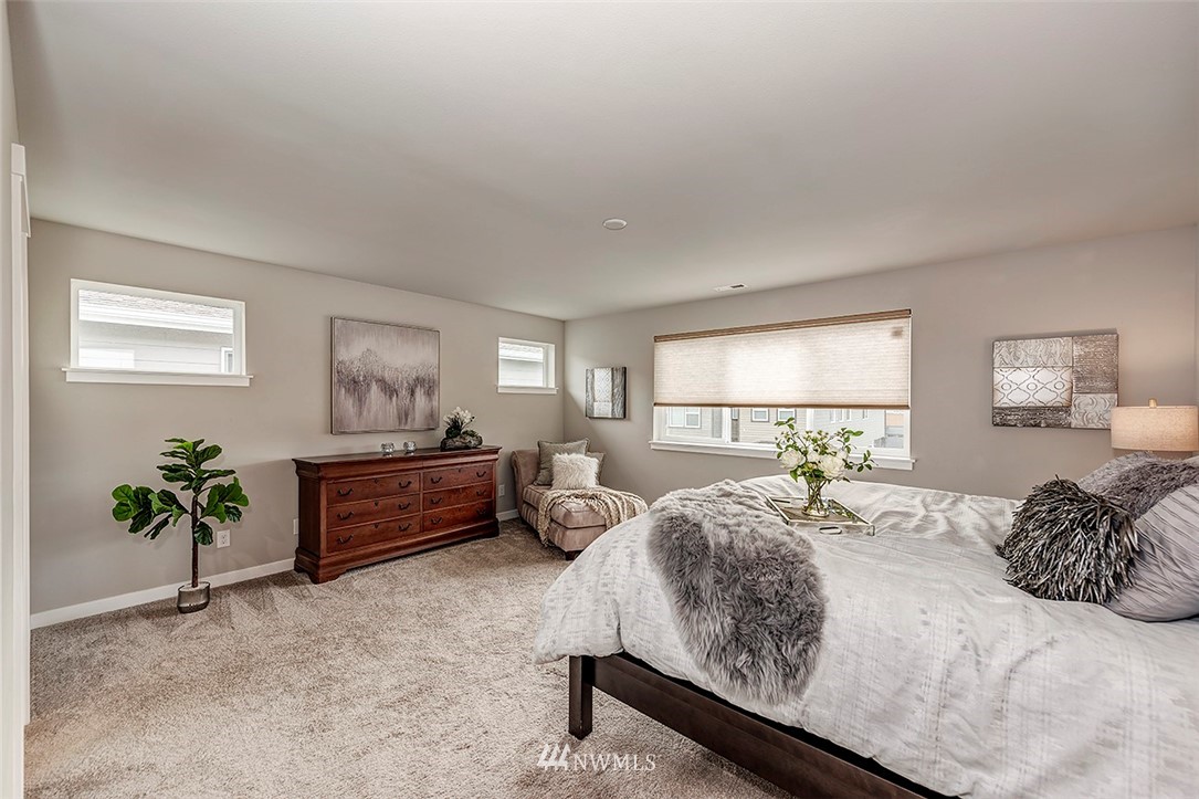 19310 37th Drive Southeast Bothell, WA 98012 - Photo 11 of 22 a bedroom with a bed and a dresser