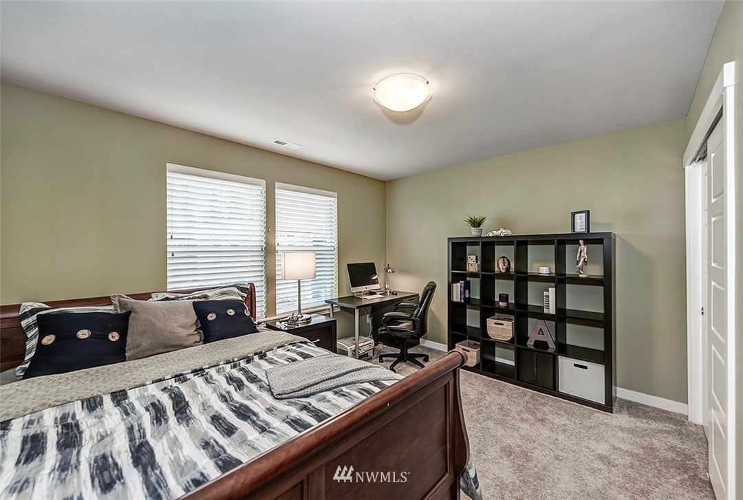 19310 37th Drive Southeast Bothell, WA 98012 - Photo 13 of 22 a bed sitting in a room next to a window