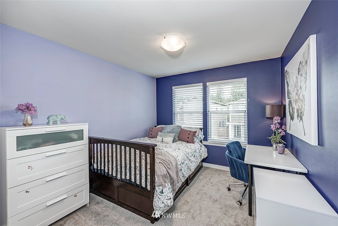 19310 37th Drive Southeast Bothell, WA 98012 - Photo 14 of 22 a bedroom with a bed and a window
