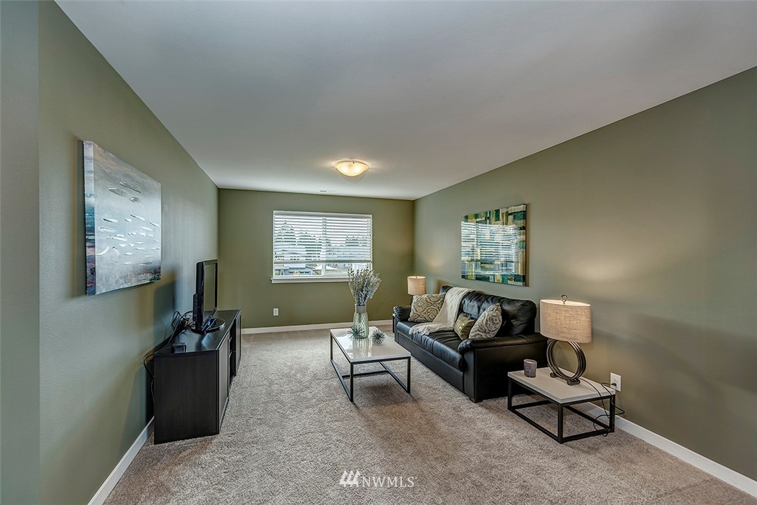19310 37th Drive Southeast Bothell, WA 98012 - Photo 16 of 22 a living room with furniture and a window