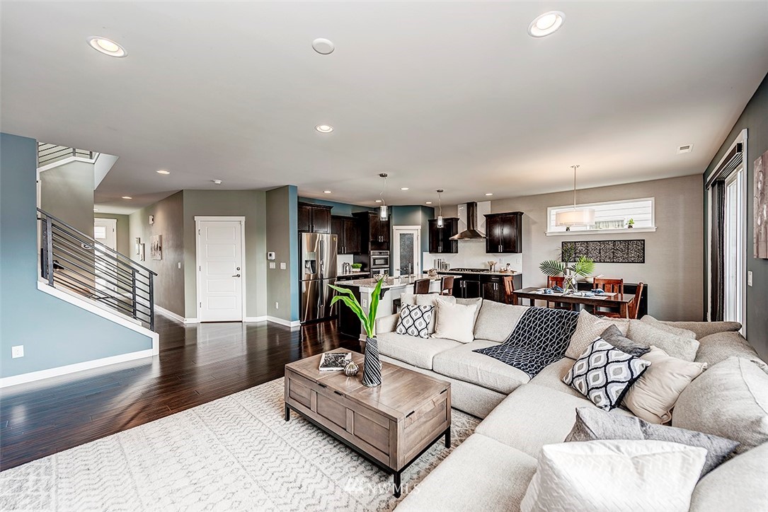 19310 37th Drive Southeast Bothell, WA 98012 - Photo 6 of 22 a living room with furniture kitchen view and a wooden floor