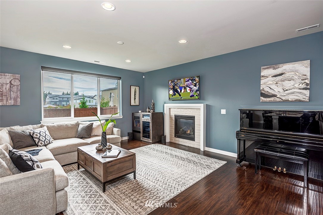 19310 37th Drive Southeast Bothell, WA 98012 - Photo 10 of 22 a living room with furniture and a fireplace