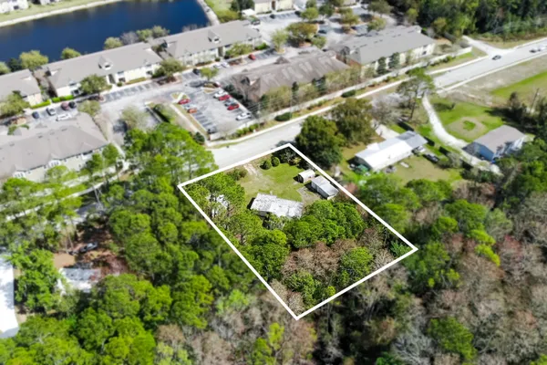 an aerial view of house with a yard
