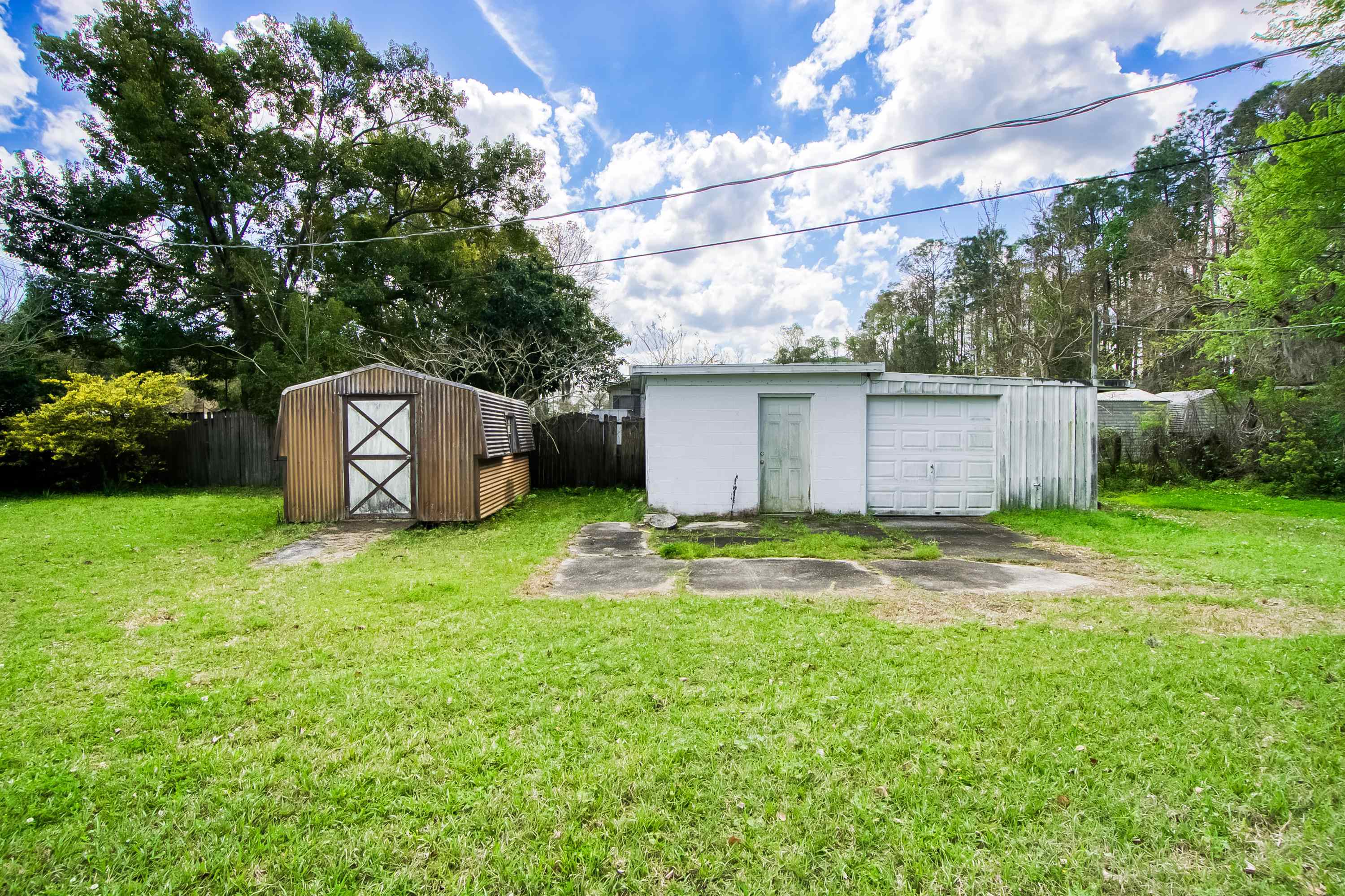 2785 Stratton Boulevard St. Augustine, FL 32084 - Photo 18 of 25 a backyard of a house with a garden and barbeque oven