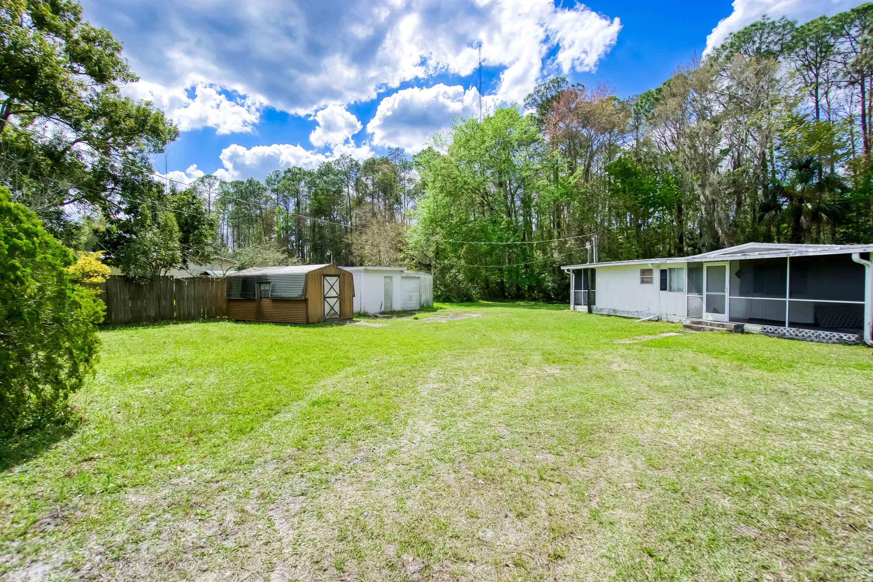 2785 Stratton Boulevard St. Augustine, FL 32084 - Photo 8 of 25 a view of a backyard with a small cabin