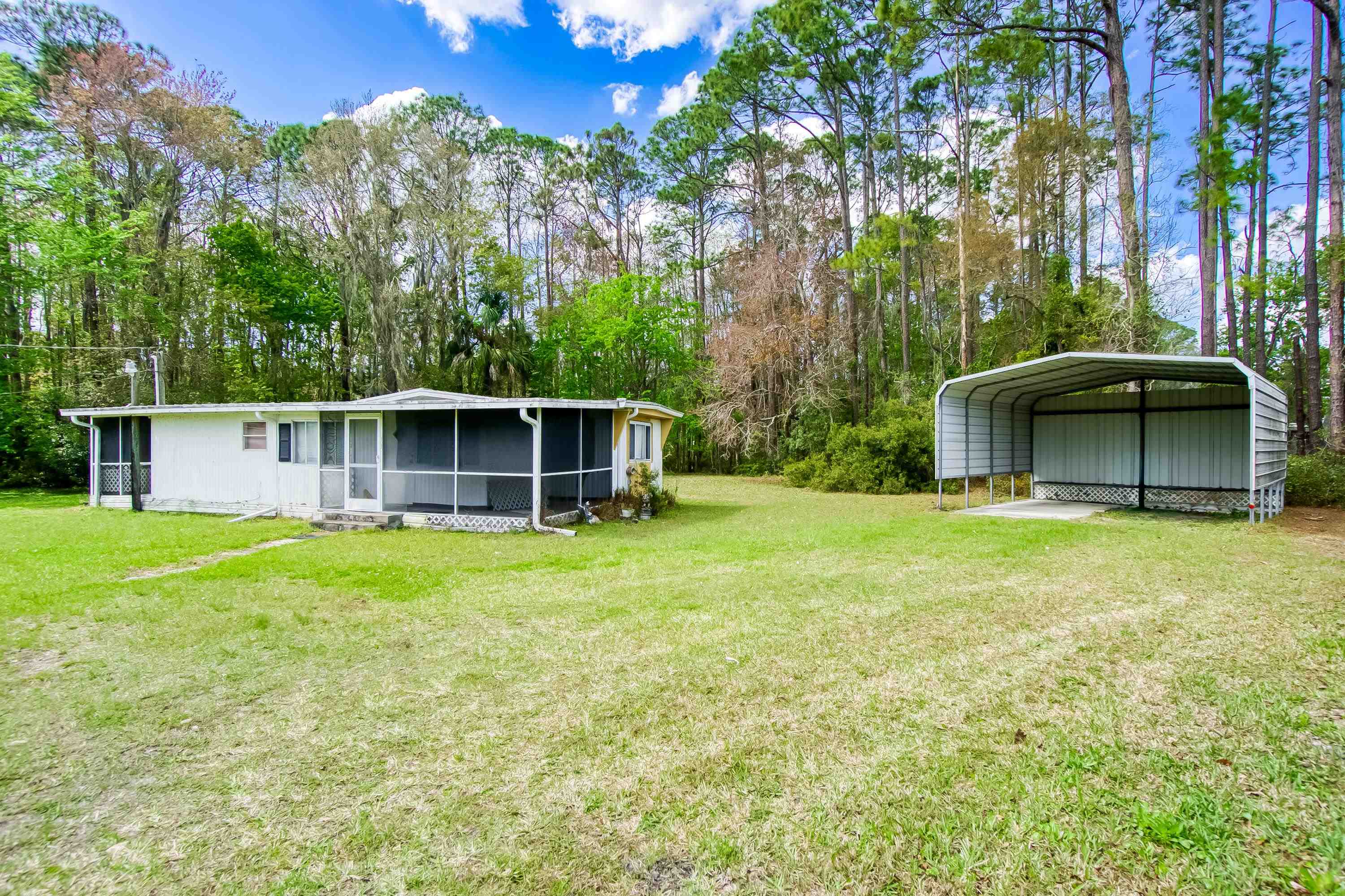 2785 Stratton Boulevard St. Augustine, FL 32084 - Photo 10 of 25 front view of a house with a yard
