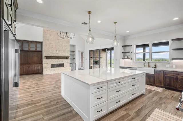 a kitchen with a sink stove and microwave