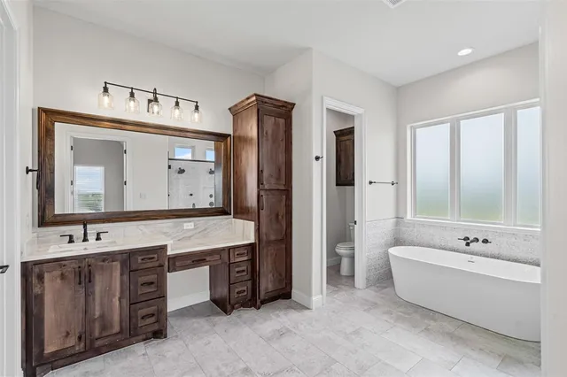 a white bath tub sitting in a bathroom
