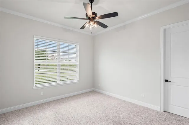 a room with window and ceiling fan
