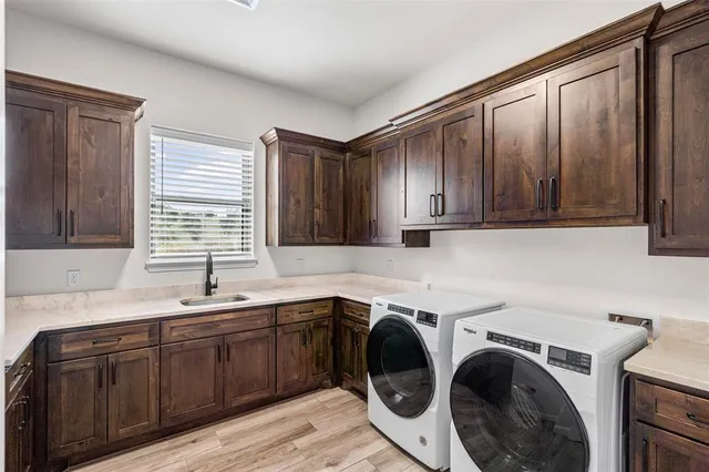 an empty room with windows and ceiling fan