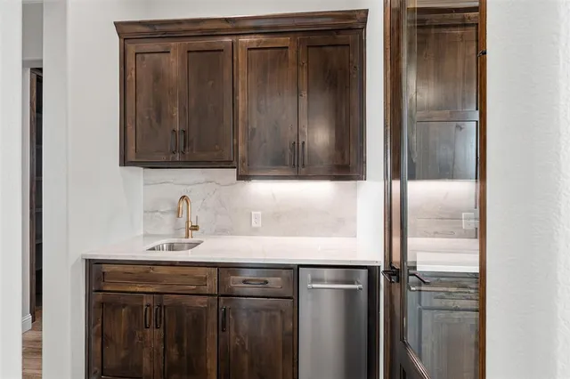a bathroom with a sink vanity and a mirror