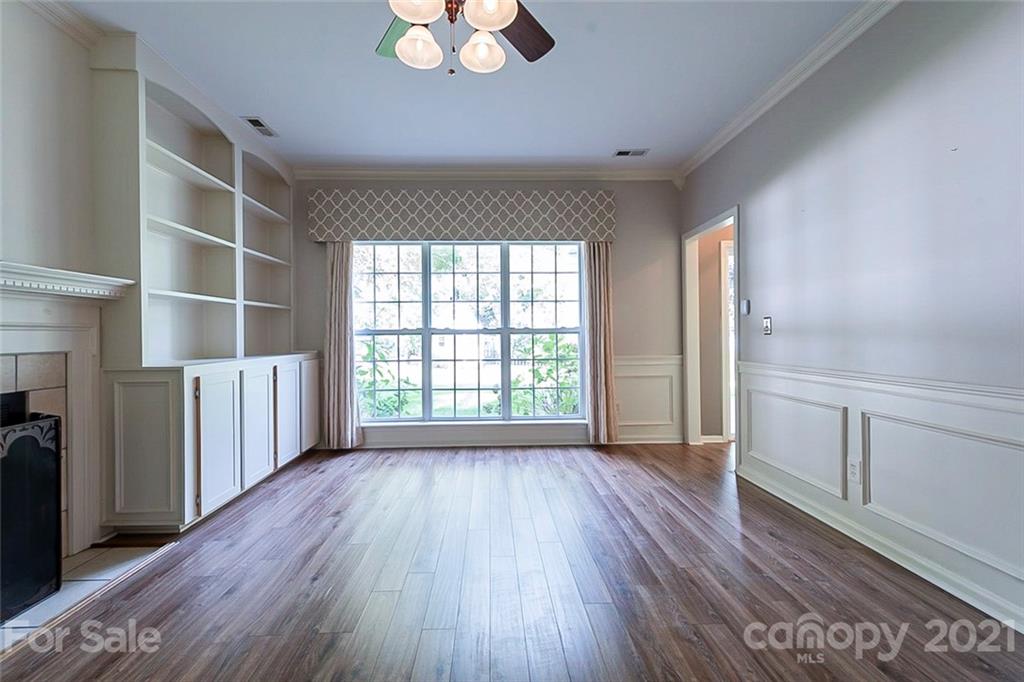 943 Knightsbridge Road Fort Mill, SC 29708 - Photo 3 of 21 an empty room with wooden floor and windows