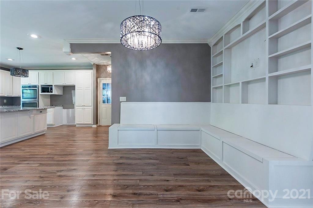 943 Knightsbridge Road Fort Mill, SC 29708 - Photo 4 of 21 a view of a kitchen with cabinets and wooden floor