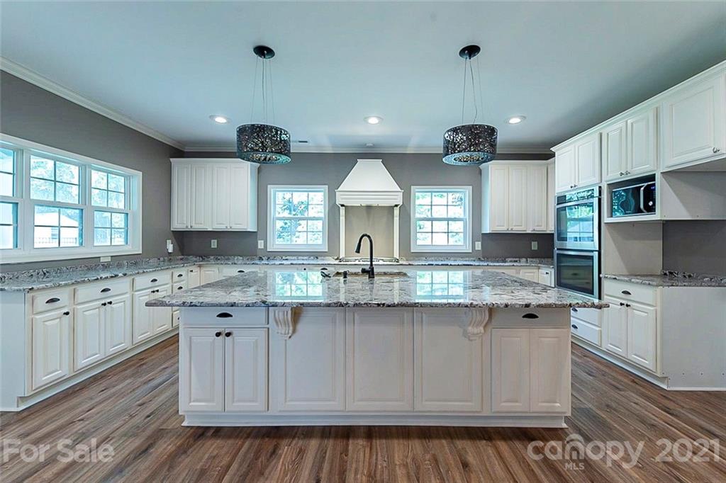 943 Knightsbridge Road Fort Mill, SC 29708 - Photo 6 of 21 a kitchen with granite countertop a sink and cabinets