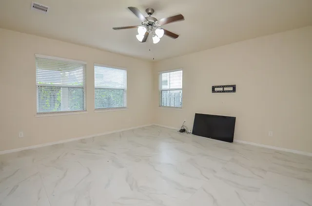 a view of an empty room with a window