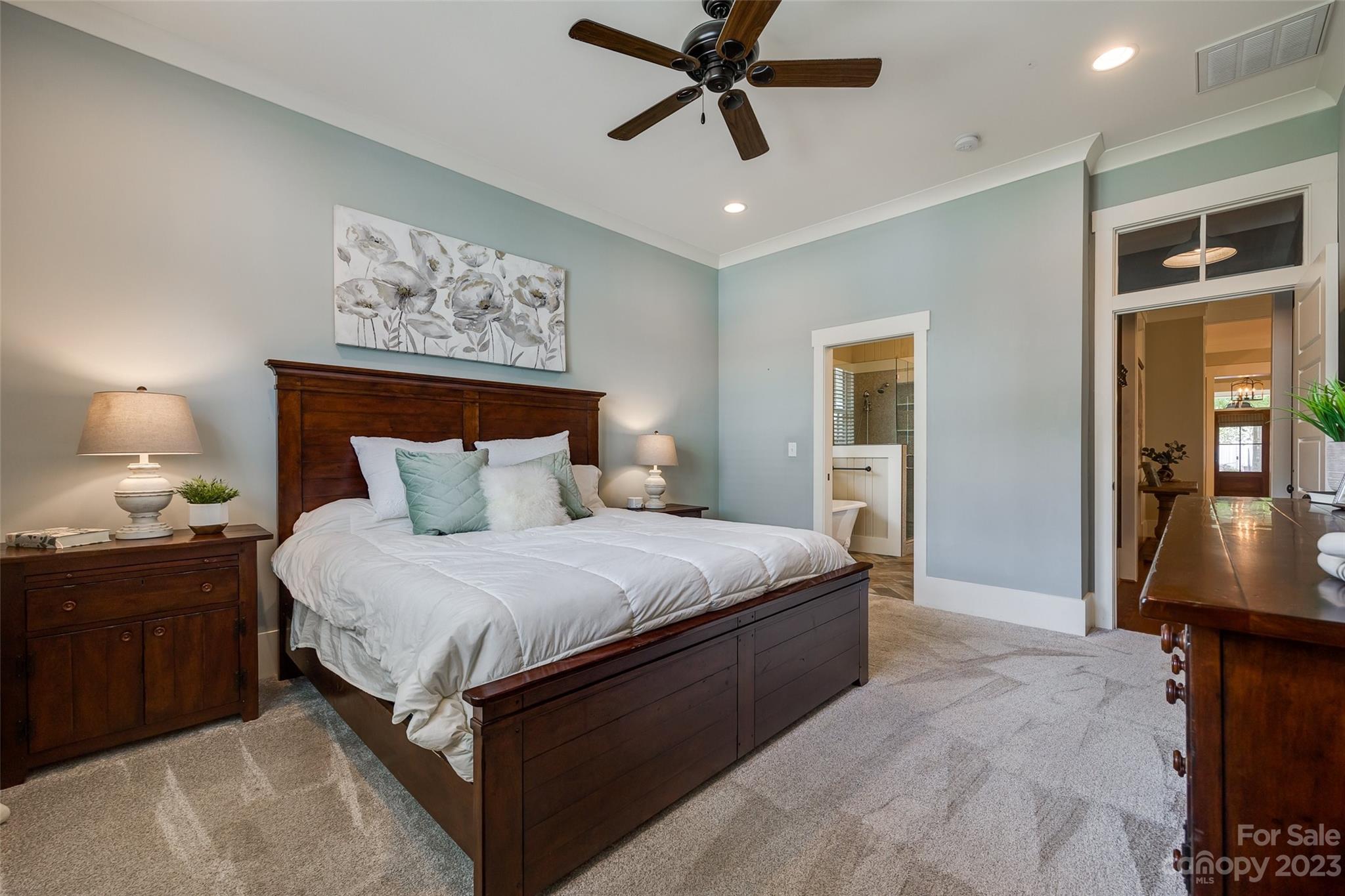 3213 Fifth Baxter Crossing Fort Mill, SC 29708 - Photo 15 of 30 a bedroom with a bed and a chandelier
