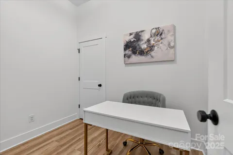 a bathroom with a toilet and a window