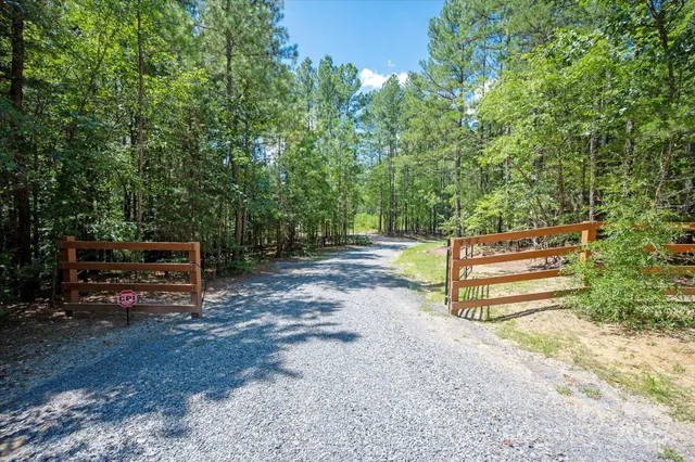 a view of backyard with seating area and green space