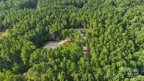 a backyard of a house with lots of plants