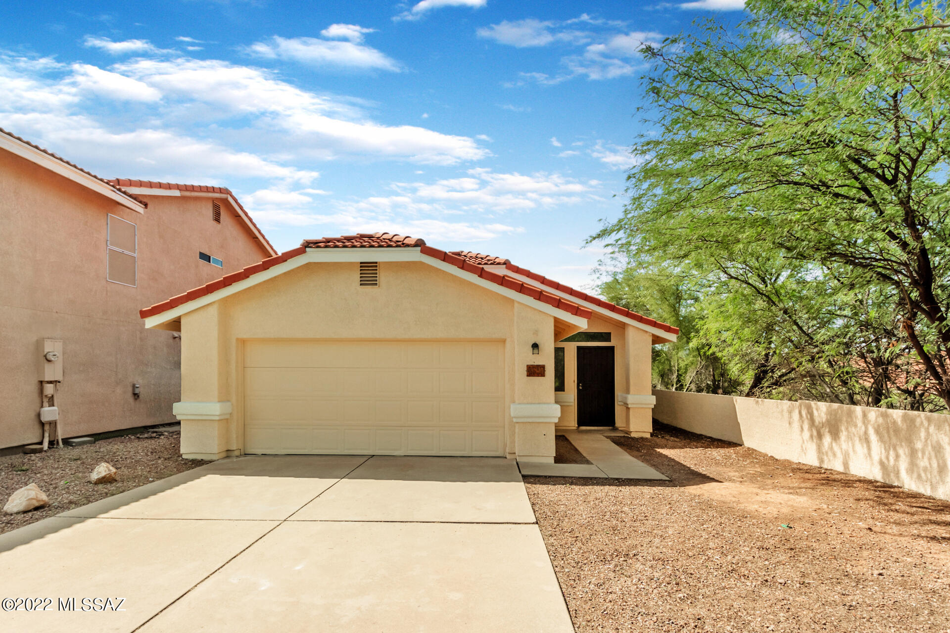 4697 West Weathervane Street Tucson, AZ 85741 - Photo 1 of 25 a view of a house with a backyard