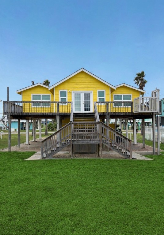 a front view of a house with a yard table and chairs