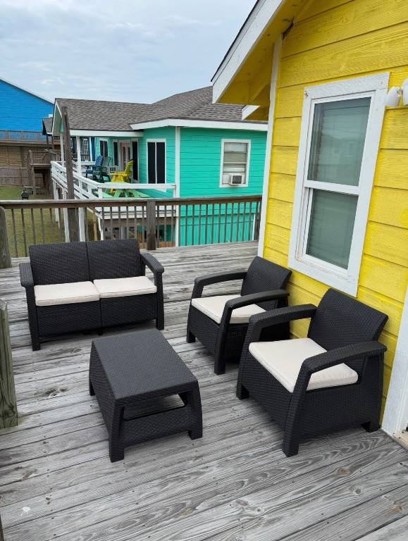 407 Seashell Drive Surfside Beach, TX 77541 - Photo 14 of 18 a view of a patio with couches chairs and wooden floor