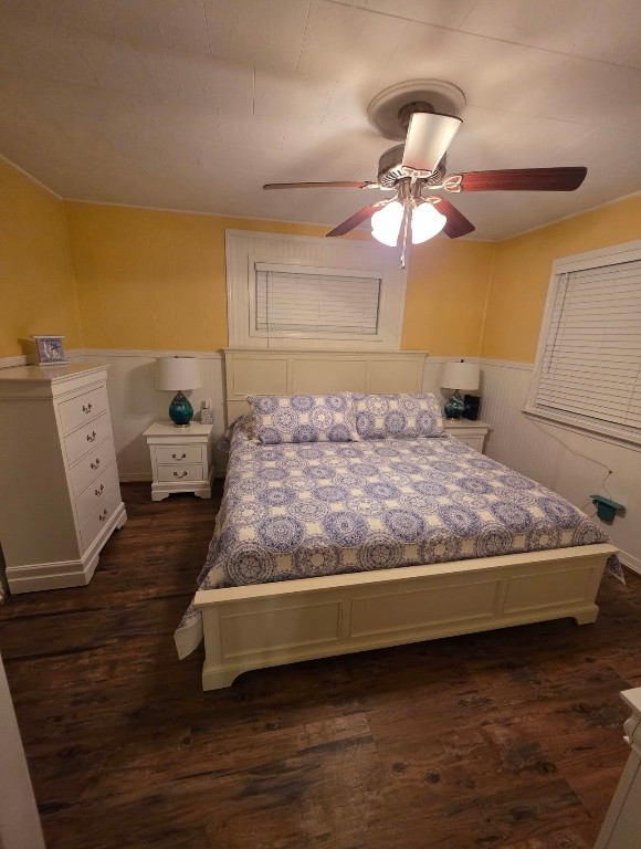 407 Seashell Drive Surfside Beach, TX 77541 - Photo 8 of 18 a bedroom with a bed and a chandelier