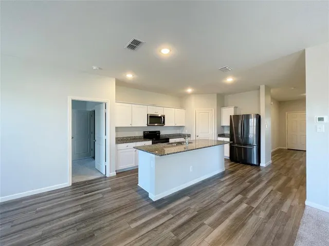 a front view of house with yard and trees