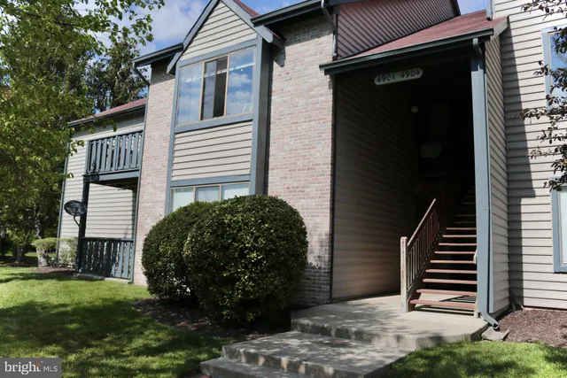 a view of a front of a house with a yard