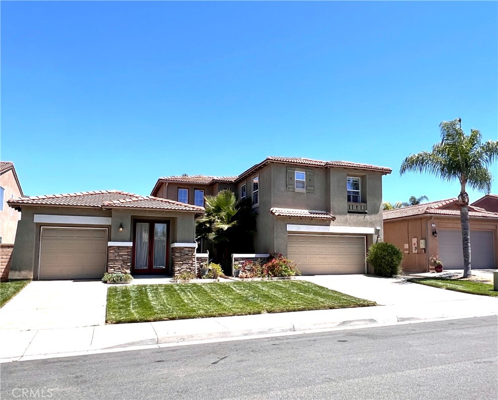 32524 Olea Road Winchester, CA 92596 - Photo 1 of 1 a front view of a house with a garden and plants