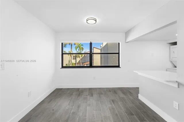 a view of utility room with two washing machine