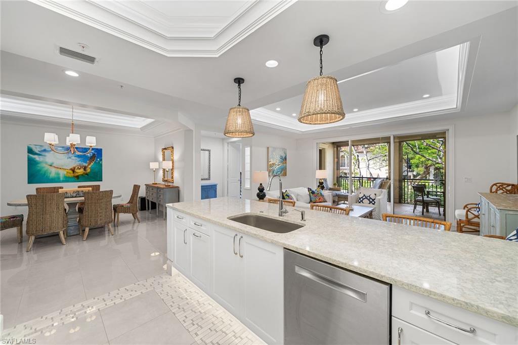411 6th Street South, Unit 202 Naples, FL 34102 - Photo 11 of 35 a kitchen with lots of counter space