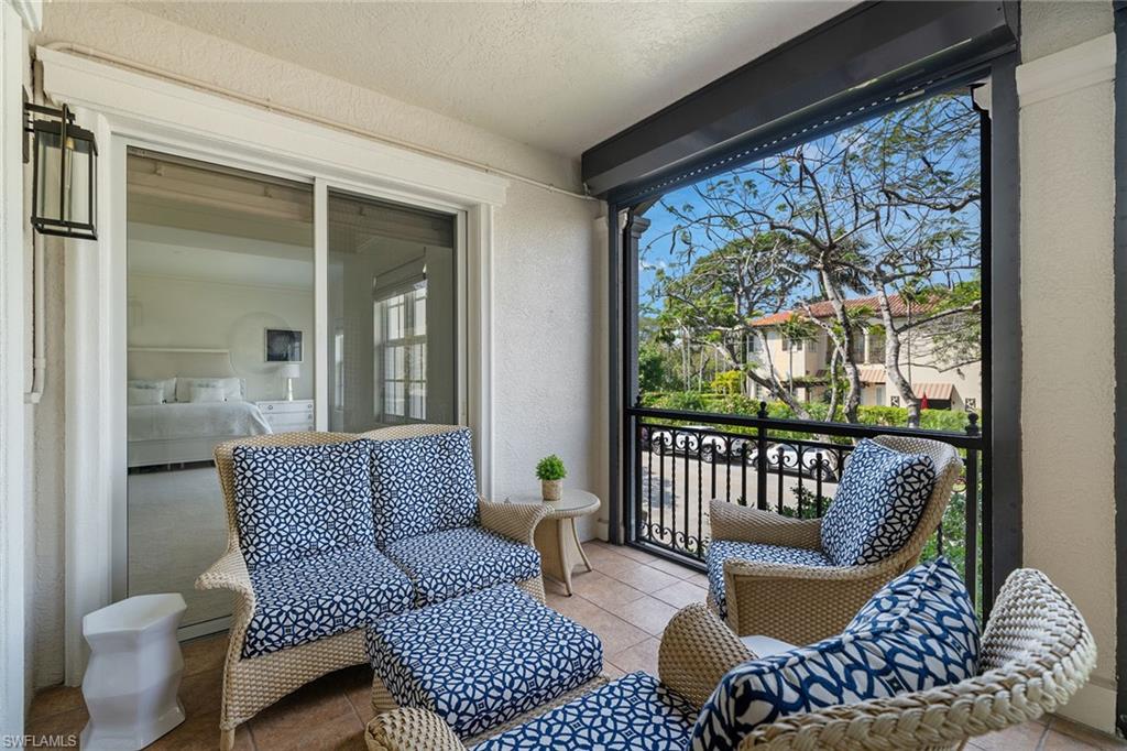 411 6th Street South, Unit 202 Naples, FL 34102 - Photo 23 of 35 a living room with furniture and a window