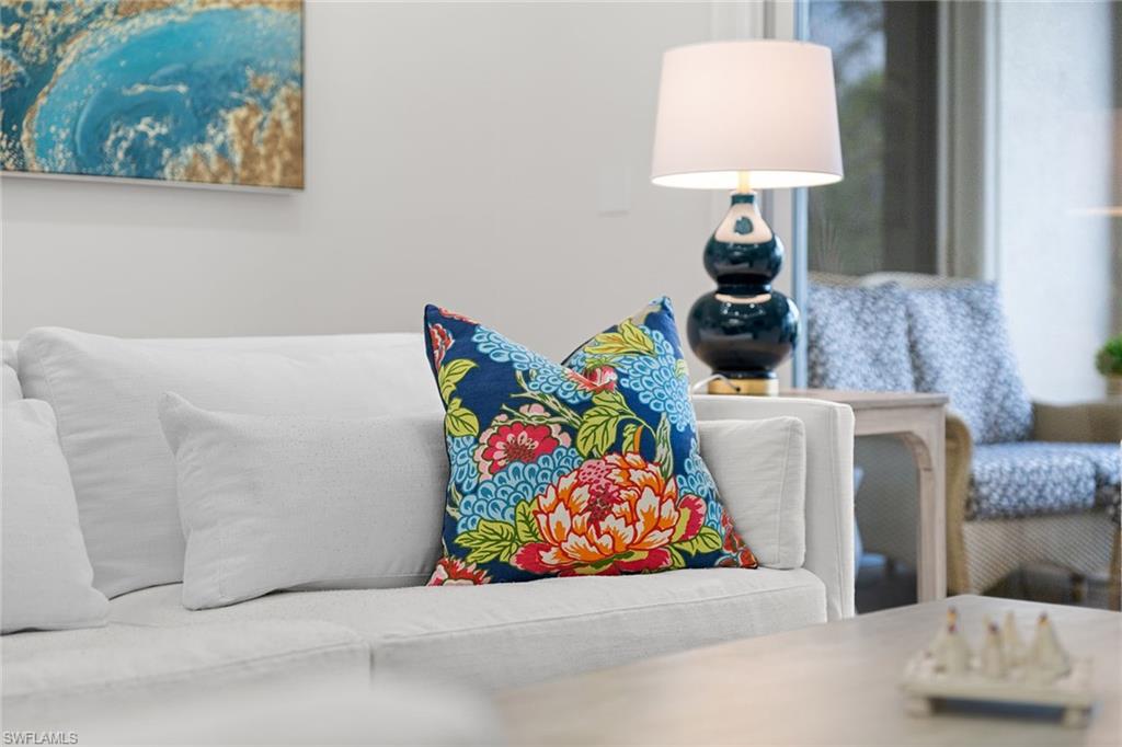 411 6th Street South, Unit 202 Naples, FL 34102 - Photo 5 of 35 a living room with furniture and a couch