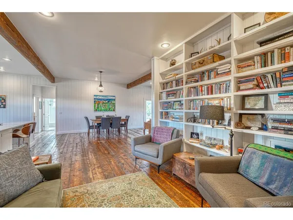 a kitchen with kitchen island granite countertop a sink cabinets and window