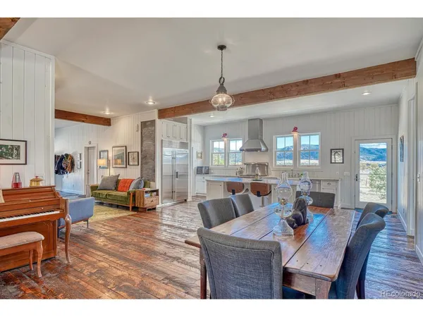 a dining room with furniture and window