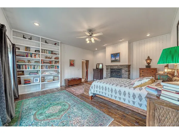 a view of a patio with table and chairs and floor to ceiling window