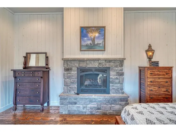 a living room with furniture and a open kitchen view